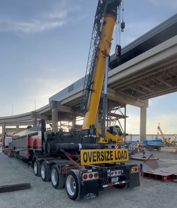 Construction equipment loaded for nationwide transport